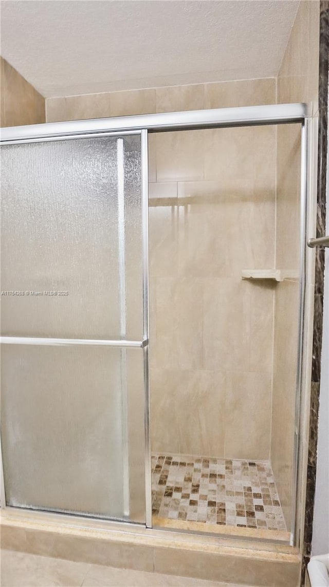 full bath featuring a stall shower