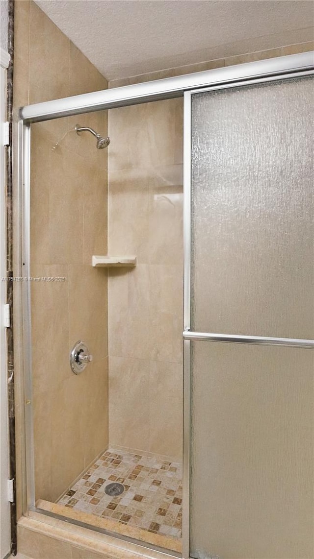 full bathroom with a shower stall