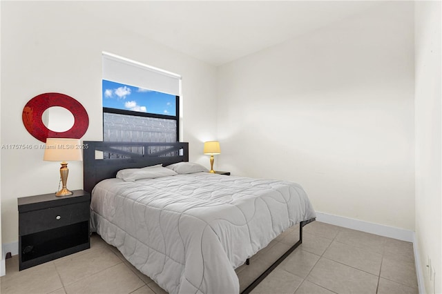 tiled bedroom with baseboards