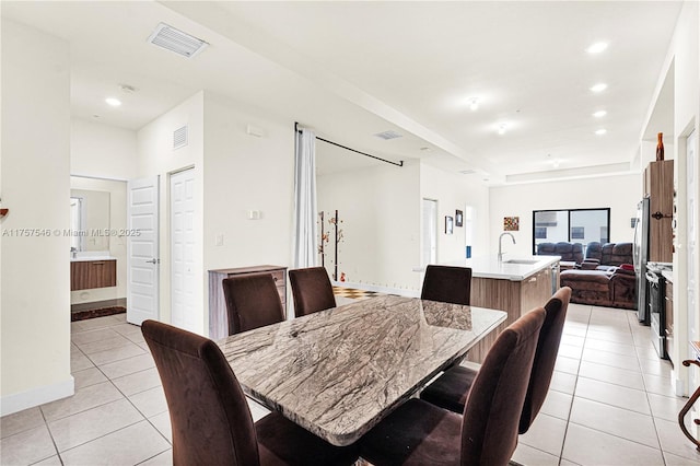 dining room with recessed lighting, visible vents, baseboards, and light tile patterned flooring