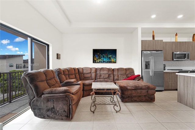 living area with light tile patterned floors and recessed lighting