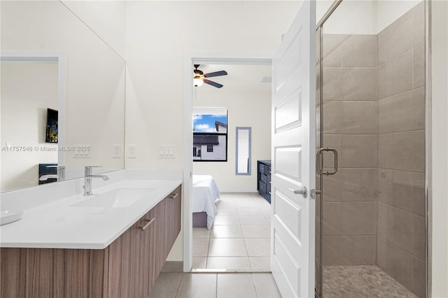 full bathroom with ceiling fan, tile patterned floors, ensuite bathroom, vanity, and a shower stall