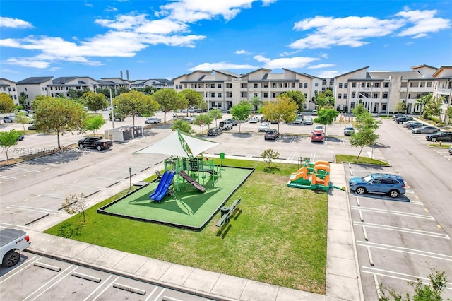 birds eye view of property with a residential view