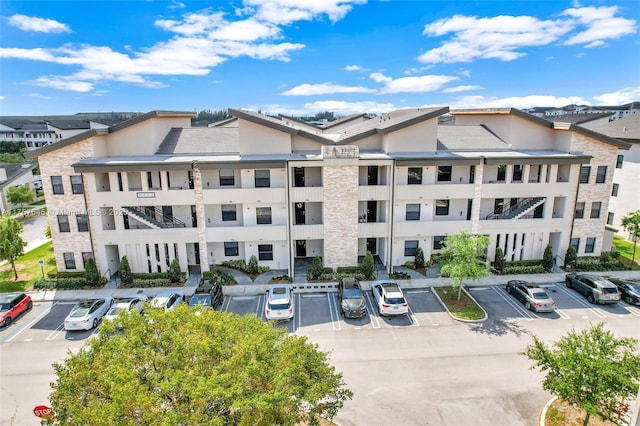 view of property with uncovered parking