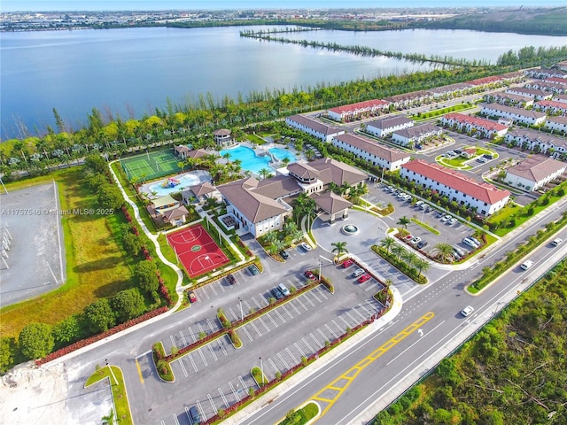 birds eye view of property with a water view