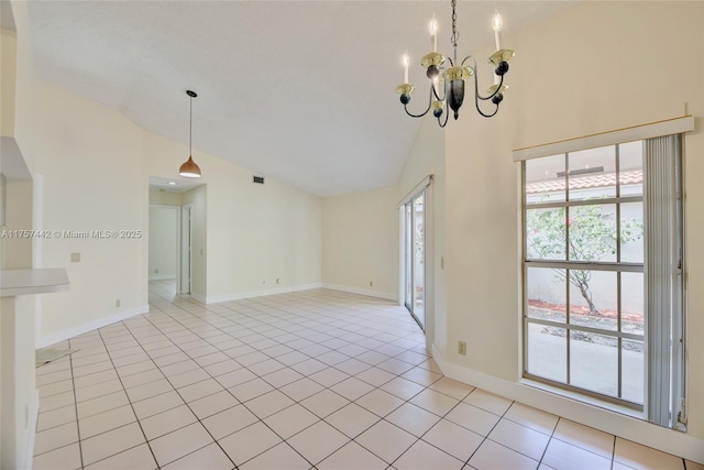 empty room with light tile patterned floors, high vaulted ceiling, a chandelier, and baseboards