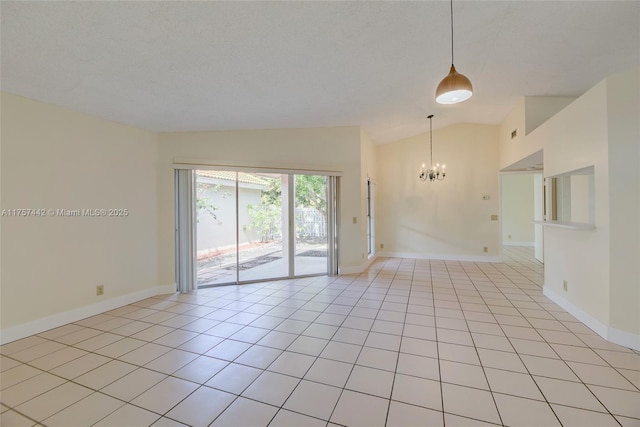 empty room with lofted ceiling, light tile patterned floors, baseboards, and an inviting chandelier