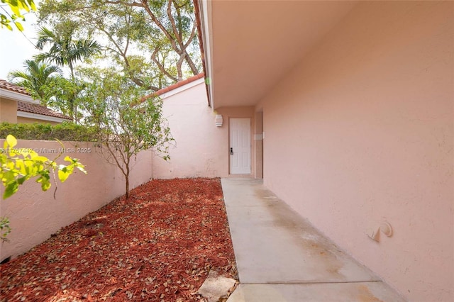 exterior space with fence and stucco siding