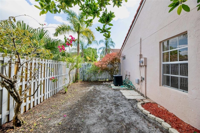 view of yard featuring a fenced backyard and central air condition unit