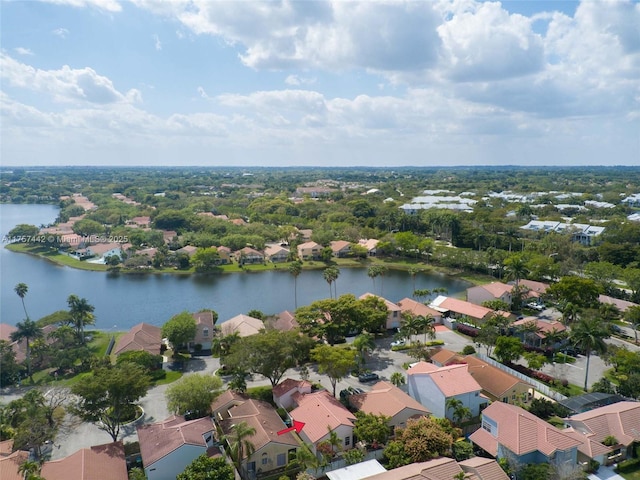 drone / aerial view featuring a water view and a residential view