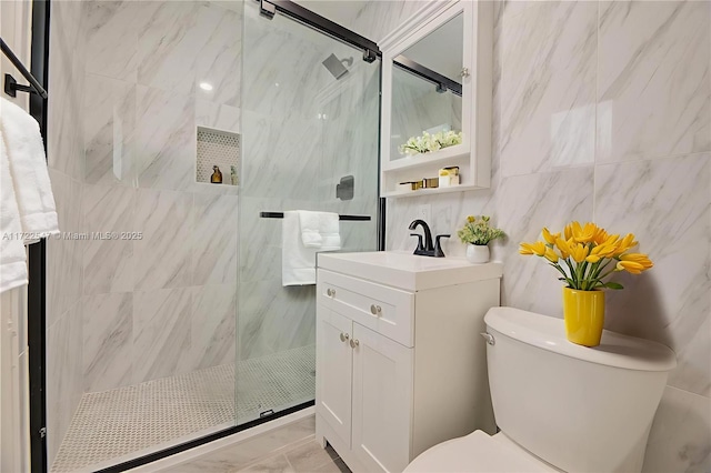610 N 31st Ct, Hollywood, FL 33021 - bathroom with toilet, a marble finish shower, vanity, tile walls, and marble look tiles