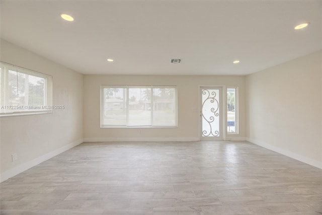 610 N 31st Ct, Hollywood, FL 33021 - unfurnished room with light wood-type flooring, baseboards, and recessed lighting