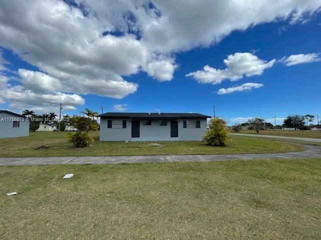 view of front of home with a front yard