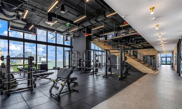 gym with expansive windows and a city view