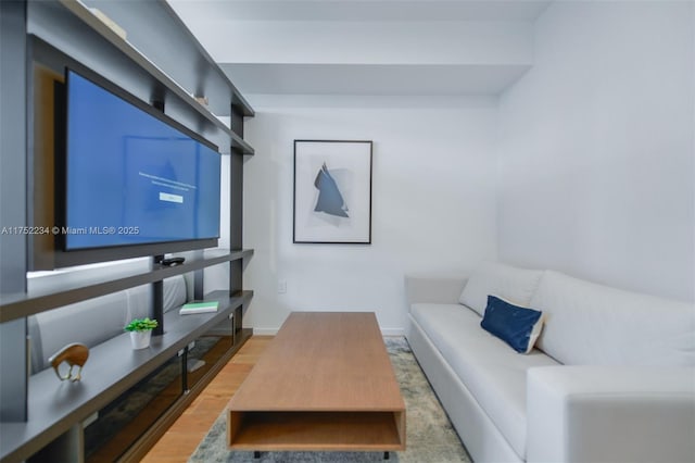 living room with light wood finished floors and baseboards