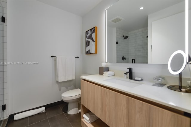 full bathroom with visible vents, toilet, a shower stall, vanity, and tile patterned flooring