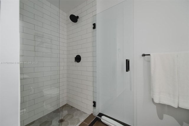 bathroom with a shower stall