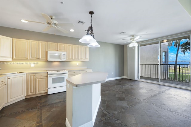 kitchen with a ceiling fan, light countertops, white appliances, and visible vents