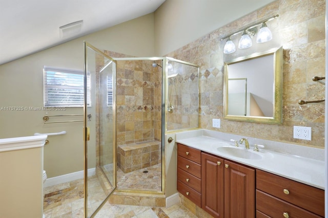 full bath featuring a shower stall, visible vents, vaulted ceiling, and vanity