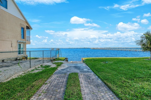 property view of water featuring fence