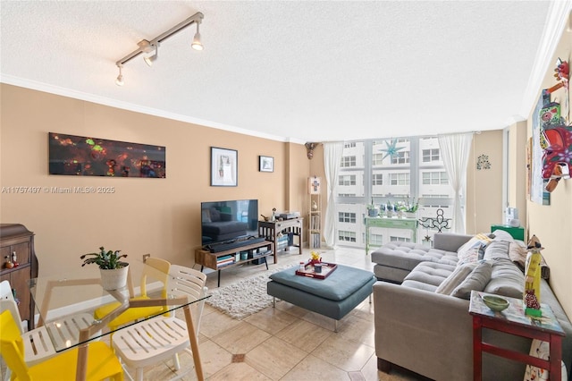 living area featuring ornamental molding, floor to ceiling windows, a textured ceiling, and light tile patterned floors