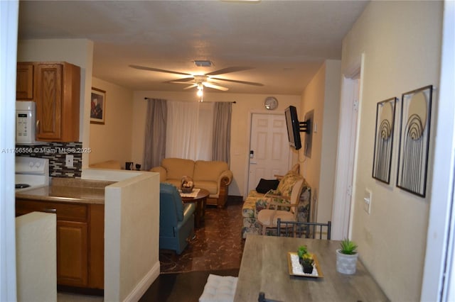 living room with a ceiling fan