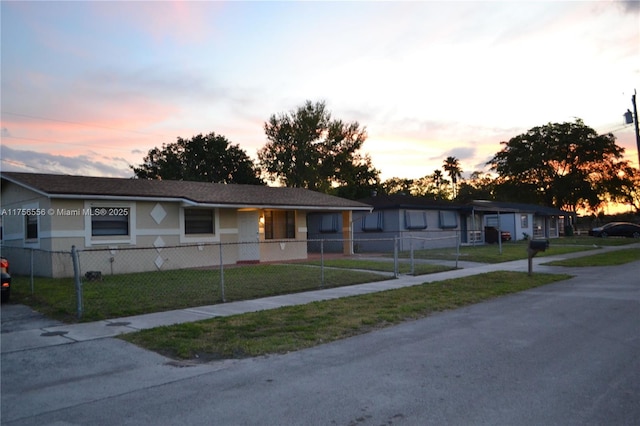 3282 NW 13th St, Lauderhill, FL 33311 - view of front of property with a fenced front yard and a front lawn