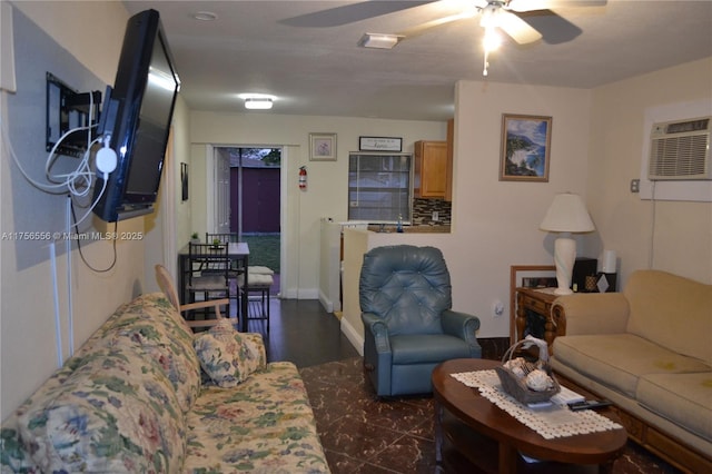 living area with a ceiling fan and a wall unit AC