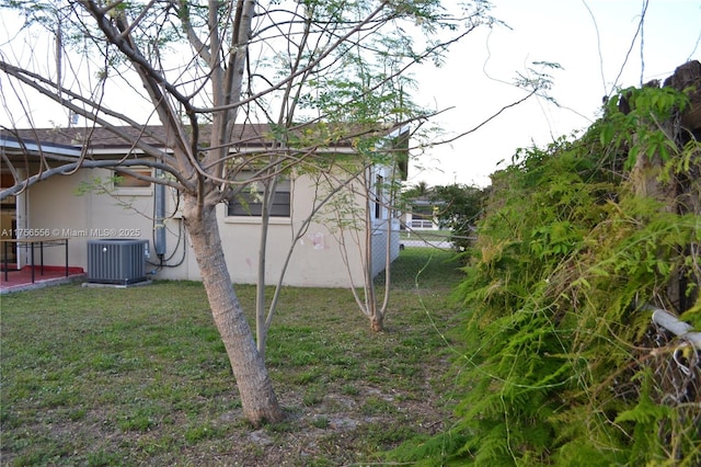 view of yard featuring central air condition unit