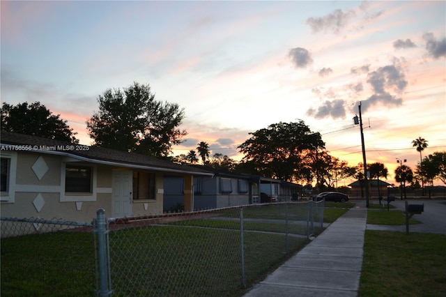 exterior space with a yard and a fenced front yard