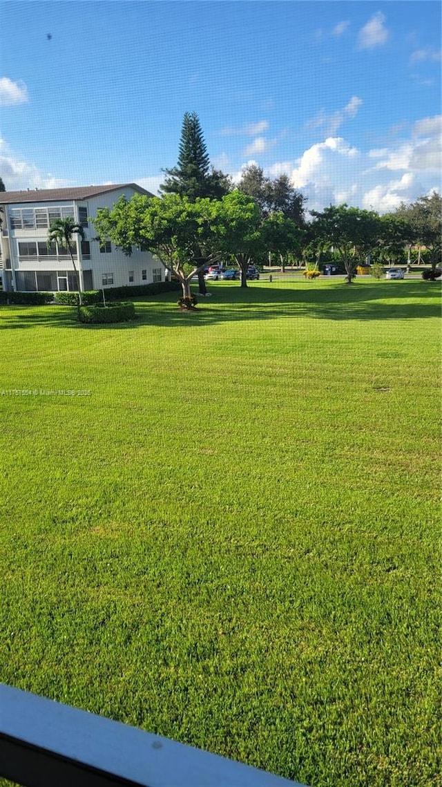 surrounding community with a lawn