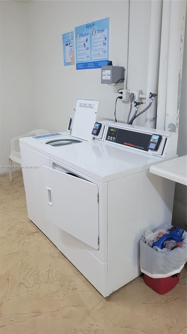 common laundry area featuring washing machine and dryer