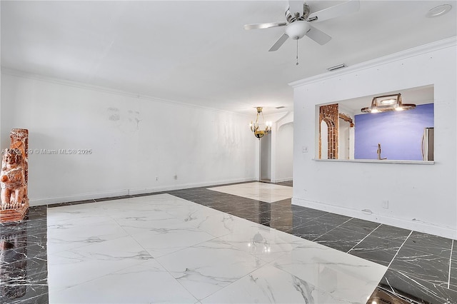 21375 Marina Cove Cir Unit 14-A, Aventura, FL 33180 - spare room featuring ceiling fan with notable chandelier, marble finish floor, ornamental molding, and baseboards