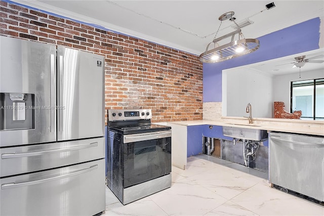 21375 Marina Cove Cir Unit 14-A, Aventura, FL 33180 - kitchen featuring marble finish floor, crown molding, appliances with stainless steel finishes, a sink, and brick wall