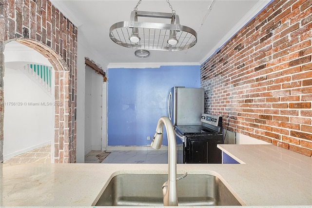 21375 Marina Cove Cir Unit 14-A, Aventura, FL 33180 - kitchen featuring brick wall, marble finish floor, stainless steel appliances, crown molding, and a sink