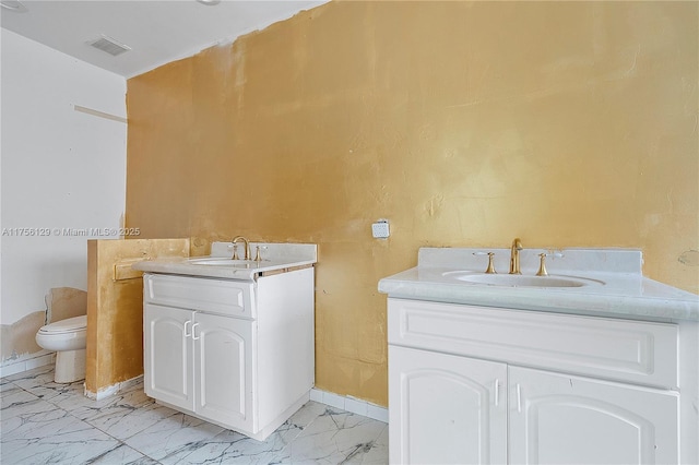 21375 Marina Cove Cir Unit 14-A, Aventura, FL 33180 - bathroom with marble finish floor, visible vents, two vanities, and a sink
