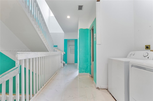 21375 Marina Cove Cir Unit 14-A, Aventura, FL 33180 - interior space featuring marble finish floor, washing machine and clothes dryer, recessed lighting, visible vents, and baseboards