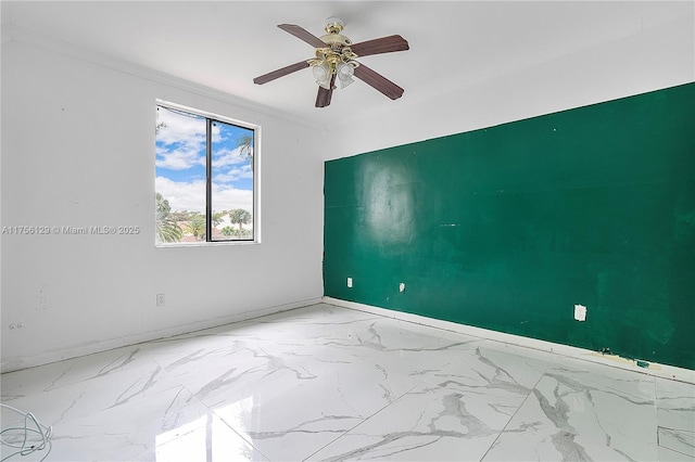 21375 Marina Cove Cir Unit 14-A, Aventura, FL 33180 - spare room with a ceiling fan, marble finish floor, and crown molding