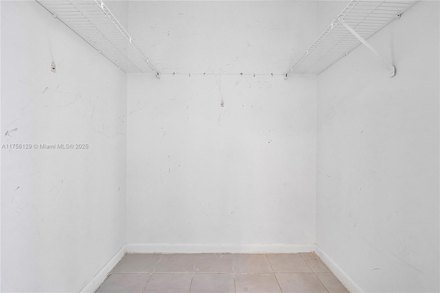 21375 Marina Cove Cir Unit 14-A, Aventura, FL 33180 - spacious closet with light tile patterned floors