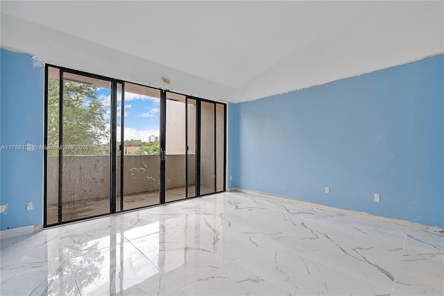 21375 Marina Cove Cir Unit 14-A, Aventura, FL 33180 - empty room with lofted ceiling and marble finish floor