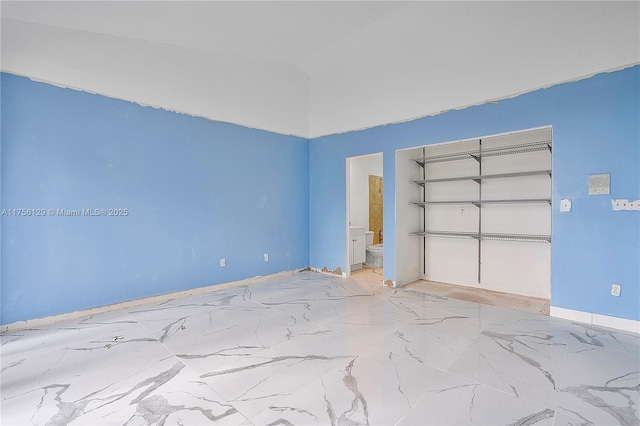 21375 Marina Cove Cir Unit 14-A, Aventura, FL 33180 - unfurnished bedroom featuring ensuite bathroom and marble finish floor