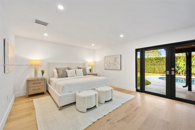 bedroom featuring light wood finished floors, visible vents, access to outside, french doors, and recessed lighting