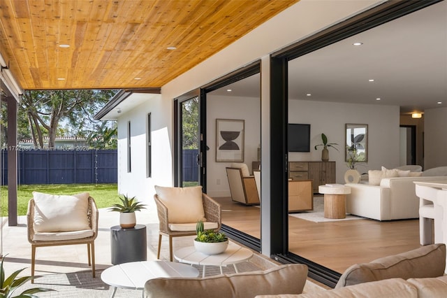 view of patio / terrace with outdoor lounge area and fence