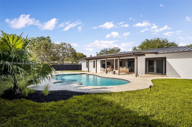 view of pool featuring fence, an outdoor living space, a yard, a fenced in pool, and a patio area