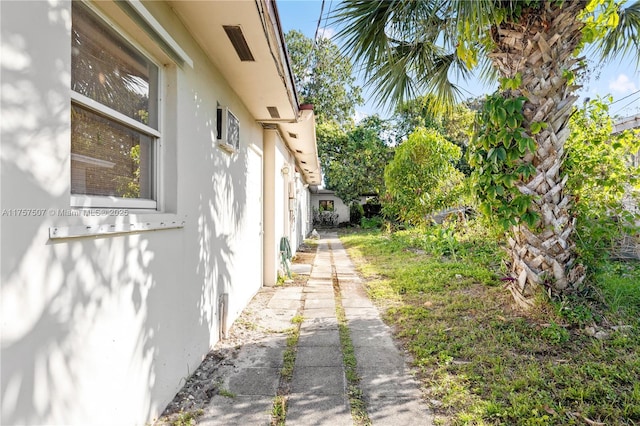 view of side of property with stucco siding