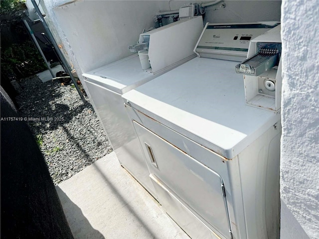 washroom with washing machine and dryer