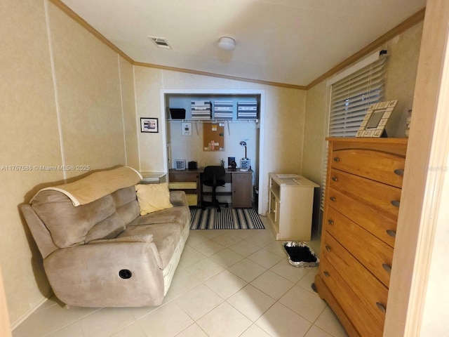 living area with ornamental molding, vaulted ceiling, light tile patterned flooring, and visible vents