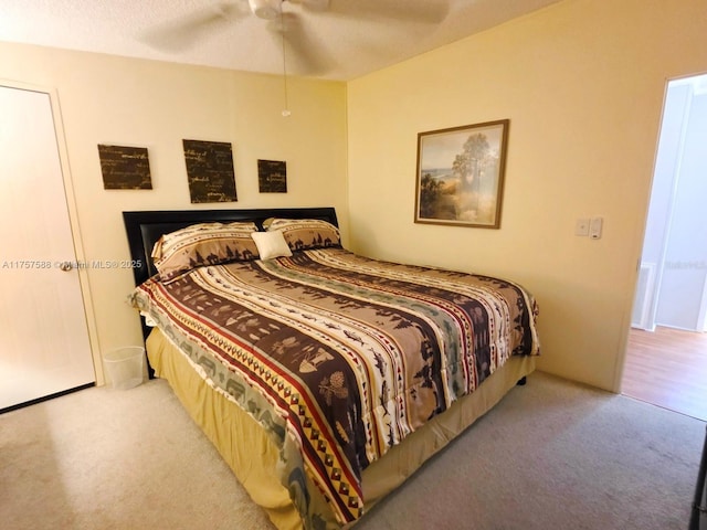 bedroom featuring a ceiling fan and carpet