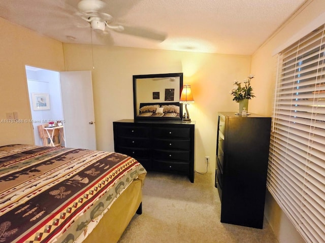 bedroom featuring ceiling fan and light colored carpet