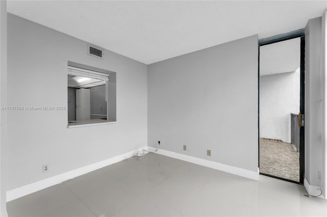 unfurnished bedroom featuring visible vents and baseboards